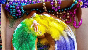 This rainbow cake is a Mardi Gras king