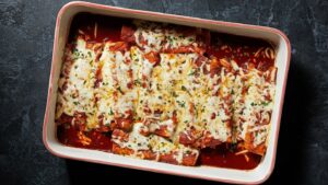 These easy chicken enchiladas deliver cheesy, saucy satisfaction