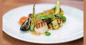 Grill up buttery scallops and zucchini for a light summer supper