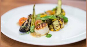 Grill up buttery scallops and zucchini for a light summer supper