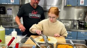 Guy Fieri shows Windsor culinary students how to wrap the perfect burrito