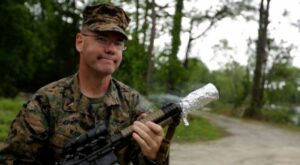 Watch as US Marine Gunner cooks crispy bacon on a rifle
