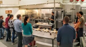 Ocala Young Professionals gather for Italian cooking lesson at local commercial kitchen