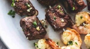 Garlic Butter Surf and Turf Kabobs easy grilled beef steak and shrimp kabob recipe | lecremedelacrumb.com | Steak and shrimp, Beef recipes, Kabob recipes