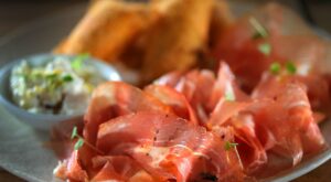 Woman says she fractured her ankle when she slipped on a piece of prosciutto; now she’s suing