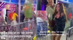 Megan Fox gets slammed into metal barricade after scuffle between Machine Gun Kelly and a person. Watch