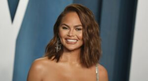 Chrissy Teigen’s Vacation Essentials Include a Suitcase Full of Legos & We Have So Many Questions – SheKnows